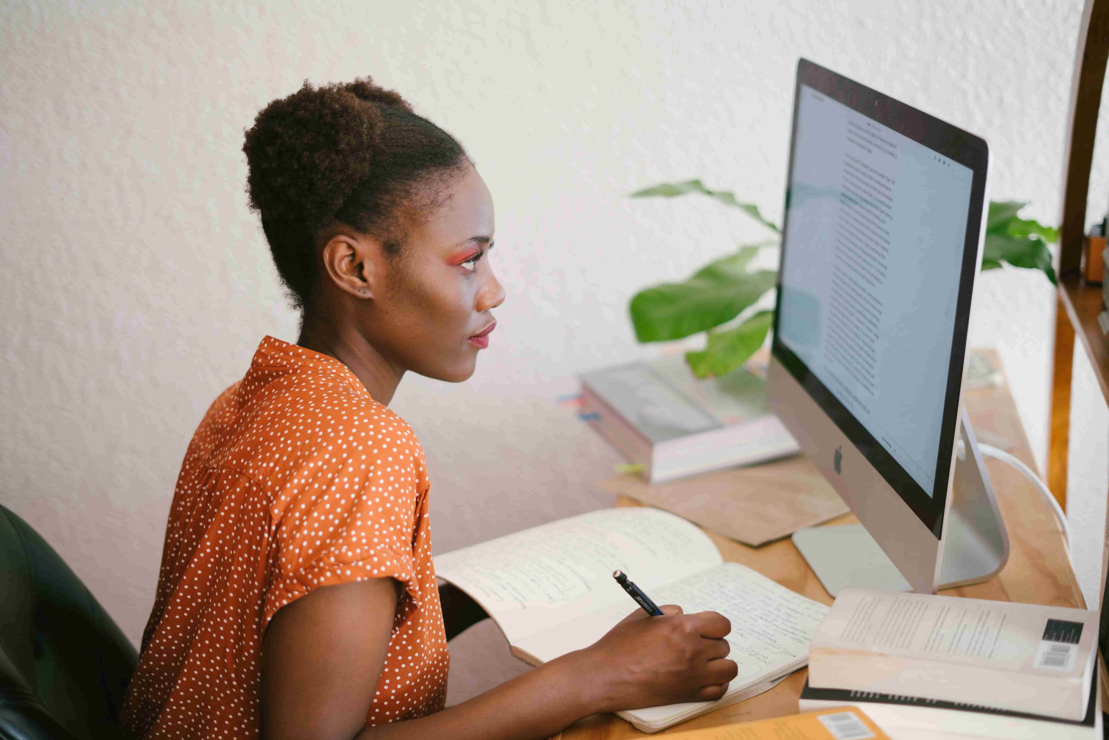 Woman having a poor posture in front of the computer