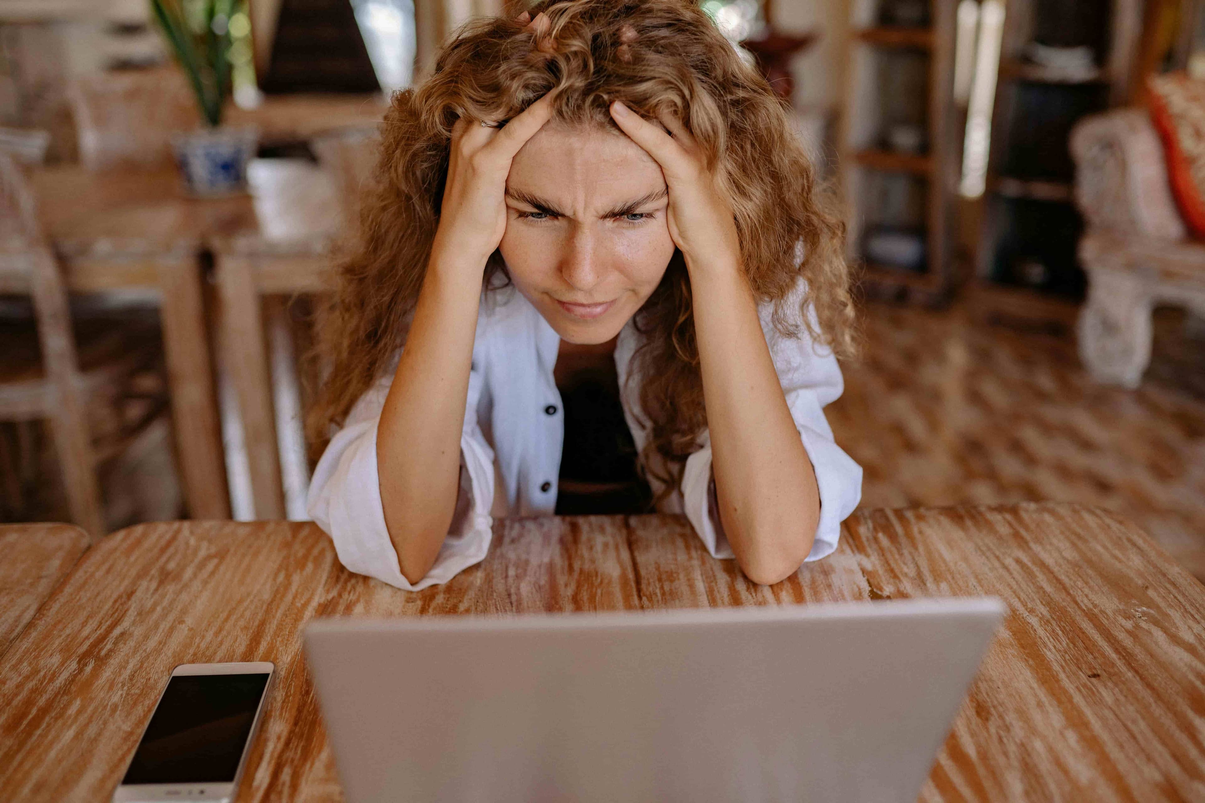 Woman being stressed at the computer