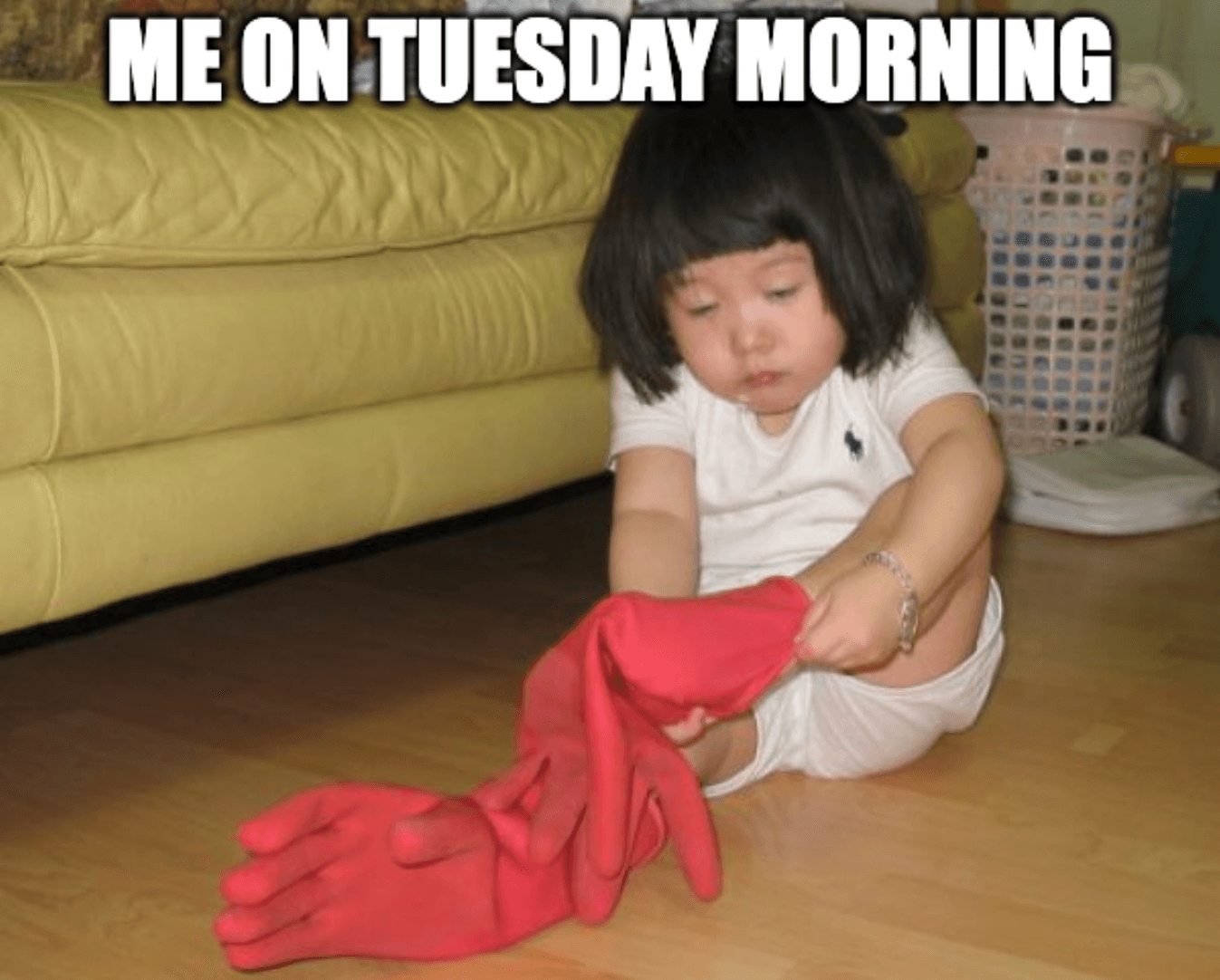 Baby tired and puts not socks on, but gloves